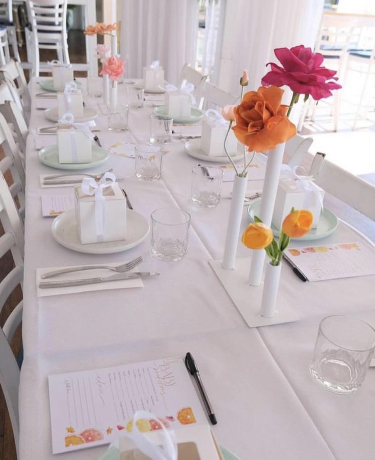 Elegant event table with colourful floral centrepieces